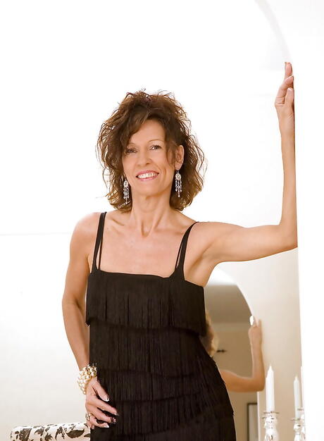 Sultry american mature India in nice skirt uncovers small tits and masturbates 