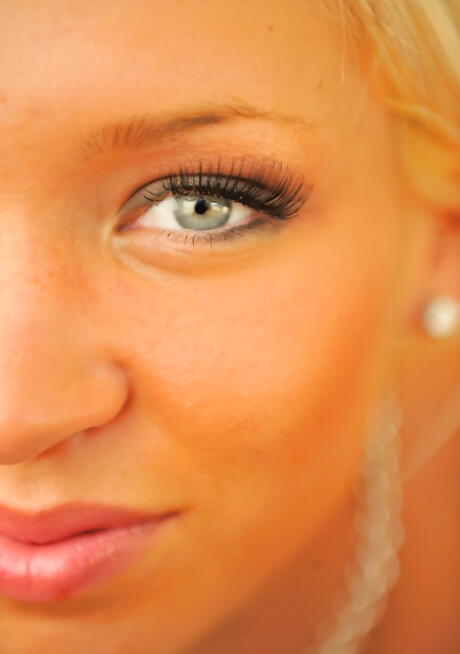 Very attractive american blonde young Kacey Jordan bares small tits and puts a toy in her pussy 